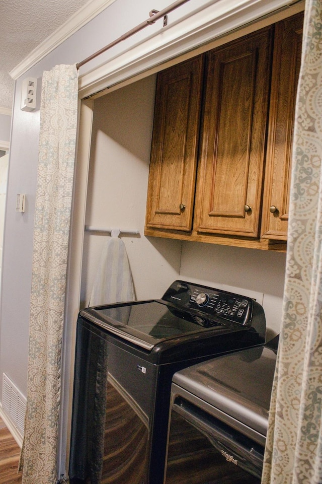 1103 Bluebonnet Hill Dr, Ennis, TX 75119 - laundry room featuring a textured ceiling and crown molding
