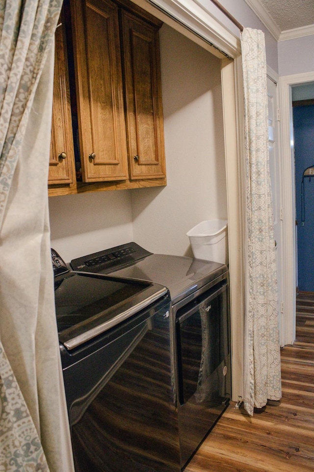 1103 Bluebonnet Hill Dr, Ennis, TX 75119 - washroom with independent washer and dryer, crown molding, and dark wood-style flooring