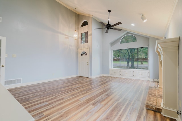 1103 Bluebonnet Hill Dr, Ennis, TX 75119 - unfurnished living room with a ceiling fan, wood finished floors, high vaulted ceiling, ornamental molding, and recessed lighting