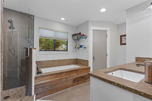 5120 Fairway Cir, Granbury, TX 76049 - bathroom with vanity, a stall shower, a bath, tile patterned flooring, and recessed lighting