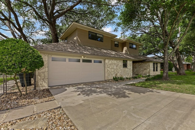 5120 Fairway Cir, Granbury, TX 76049 - view of front facade with stone siding, driveway, roof with shingles, and a garage