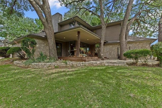 5120 Fairway Cir, Granbury, TX 76049 - view of front of property with stone siding, a chimney, a front lawn, and a porch