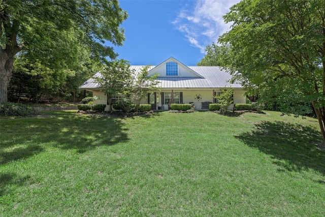 1000 Ballard Rd, Van Alstyne, TX 75495 - rear view of property featuring stucco siding, a yard, and metal roof