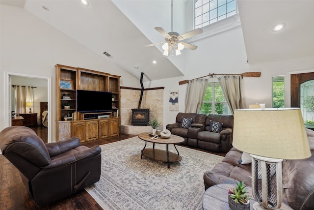 1000 Ballard Rd, Van Alstyne, TX 75495 - living area featuring high vaulted ceiling, dark wood-style flooring, a ceiling fan, recessed lighting, and a wood stove