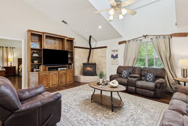 1000 Ballard Rd, Van Alstyne, TX 75495 - living room featuring ceiling fan, wood finished floors, high vaulted ceiling, and a wood stove