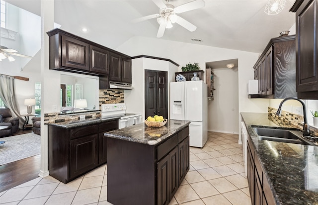 1000 Ballard Rd, Van Alstyne, TX 75495 - kitchen with white appliances, ceiling fan, a sink, under cabinet range hood, and lofted ceiling