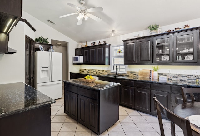 1000 Ballard Rd, Van Alstyne, TX 75495 - kitchen featuring white appliances, a sink, lofted ceiling, ceiling fan, and light tile patterned floors
