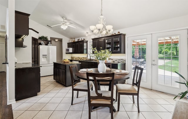 1000 Ballard Rd, Van Alstyne, TX 75495 - dining room featuring vaulted ceiling, light tile patterned floors, a chandelier, ceiling fan, and french doors