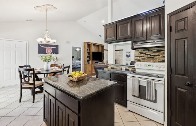 1000 Ballard Rd, Van Alstyne, TX 75495 - kitchen with white electric range oven, under cabinet range hood, light tile patterned flooring, backsplash, and a chandelier