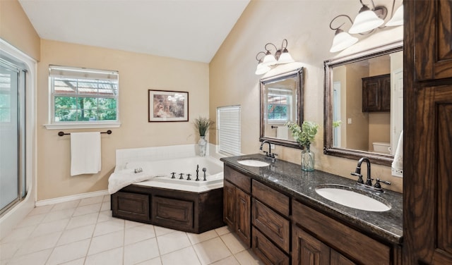 1000 Ballard Rd, Van Alstyne, TX 75495 - bathroom with lofted ceiling, plenty of natural light, a garden tub, toilet, and double vanity