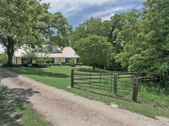 1000 Ballard Rd, Van Alstyne, TX 75495 - view of front of property with metal roof, a gate, and dirt driveway