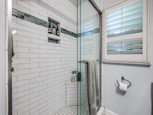 879 Peavy Rd, Dallas, TX 75218 - bathroom with a stall shower and baseboards