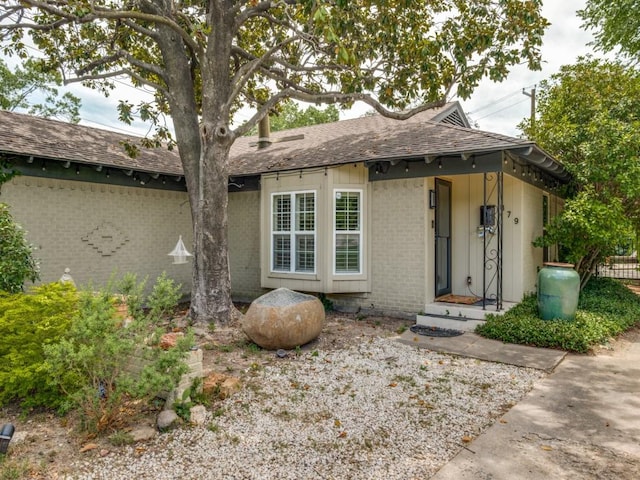 879 Peavy Rd, Dallas, TX 75218 - view of front of home with brick siding and a shingled roof