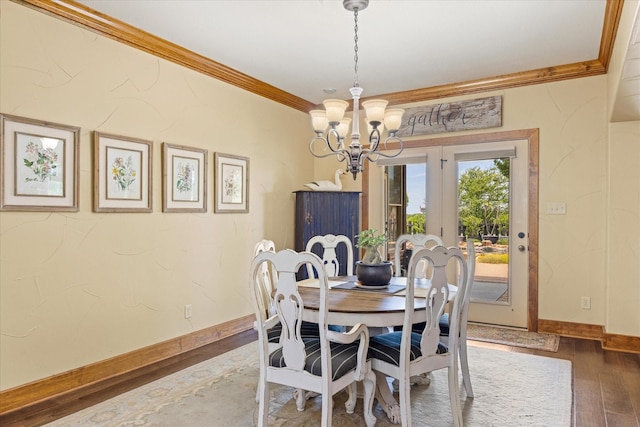 1096 Black Hawk Trl, Nemo, TX 76070 - dining room with crown molding, a chandelier, wood-type flooring, and baseboards