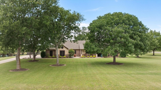 1096 Black Hawk Trl, Nemo, TX 76070 - obstructed view of property with a front yard and brick siding