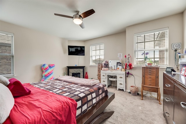 2211 Barrow St, Princeton, TX 75407 - bedroom featuring light colored carpet, a fireplace, and ceiling fan