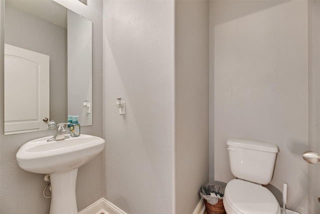 2211 Barrow St, Princeton, TX 75407 - half bath with toilet and baseboards
