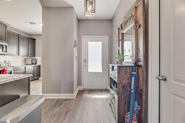 2211 Barrow St, Princeton, TX 75407 - entryway featuring plenty of natural light, light wood-style flooring, and baseboards