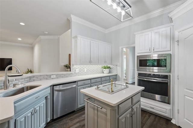 1137 Countryhill Dr, Keller, TX 76248 - kitchen with appliances with stainless steel finishes, a sink, light countertops, crown molding, and decorative backsplash