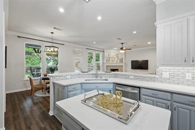 1137 Countryhill Dr, Keller, TX 76248 - kitchen featuring dishwasher, a ceiling fan, gray cabinets, a sink, and tasteful backsplash