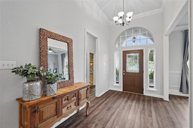 1137 Countryhill Dr, Keller, TX 76248 - entrance foyer featuring dark wood-style floors, plenty of natural light, a chandelier, crown molding, and baseboards