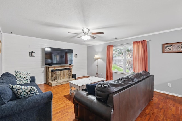 1500 Caymus Ct, Lewisville, TX 75067 - living room featuring ceiling fan, wood finished floors, and baseboards