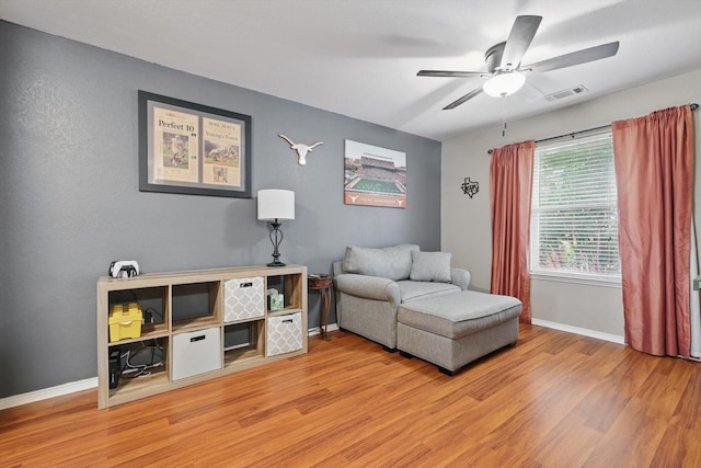 1500 Caymus Ct, Lewisville, TX 75067 - living area featuring light wood-type flooring, ceiling fan, and baseboards