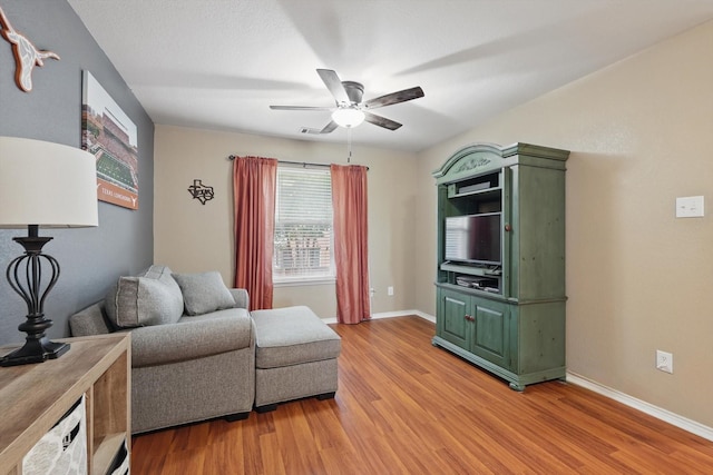 1500 Caymus Ct, Lewisville, TX 75067 - living area with a ceiling fan, light wood-style flooring, and baseboards