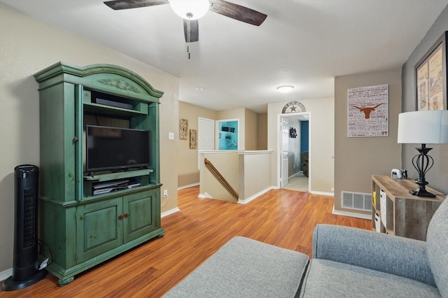 1500 Caymus Ct, Lewisville, TX 75067 - living area with light wood-style floors, baseboards, and ceiling fan
