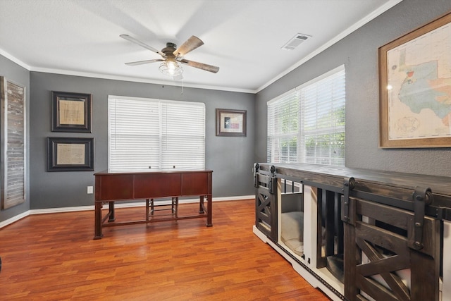 1500 Caymus Ct, Lewisville, TX 75067 - office area featuring crown molding, a ceiling fan, wood finished floors, and baseboards