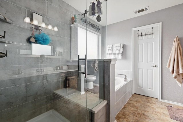 1500 Caymus Ct, Lewisville, TX 75067 - bathroom featuring a bath, tiled shower, and toilet