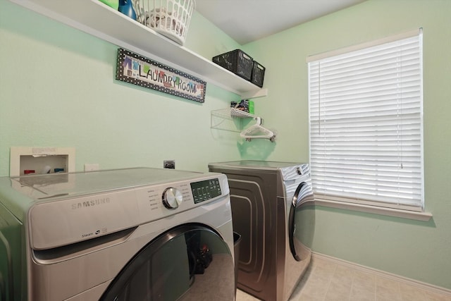 1500 Caymus Ct, Lewisville, TX 75067 - laundry room featuring washing machine and clothes dryer and baseboards