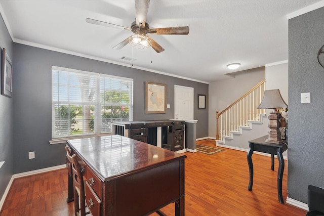 1500 Caymus Ct, Lewisville, TX 75067 - home office featuring a ceiling fan, wood finished floors, baseboards, and crown molding