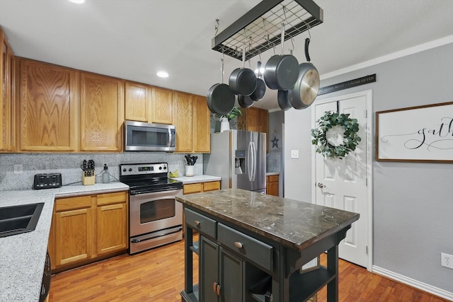 1500 Caymus Ct, Lewisville, TX 75067 - kitchen with appliances with stainless steel finishes, backsplash, light wood-style flooring, open shelves, and recessed lighting