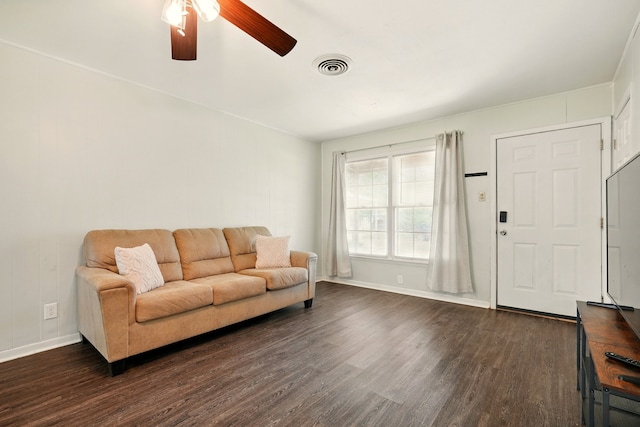 3249 Sandefer St, Abilene, TX 79603 - living room with dark wood finished floors, a ceiling fan, and baseboards