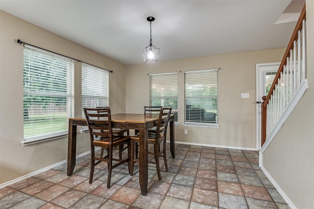 4430 Morning Star Ln, Midlothian, TX 76065 - dining room featuring stone finish flooring, baseboards, and plenty of natural light