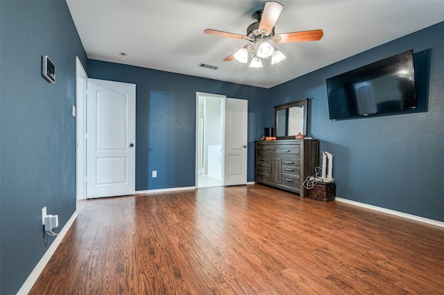 4430 Morning Star Ln, Midlothian, TX 76065 - unfurnished bedroom with wood finished floors, baseboards, and ceiling fan