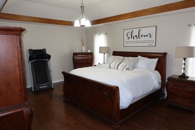 3035 Briarwood Dr, Paris, TX 75460 - bedroom featuring dark wood-type flooring and baseboards