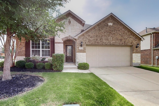 691 Hobie Point Dr, Lewisville, TX 75056 - french country home featuring stone siding, a garage, concrete driveway, a front yard, and brick siding