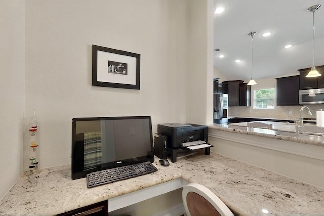 691 Hobie Point Dr, Lewisville, TX 75056 - kitchen featuring appliances with stainless steel finishes, light stone countertops, hanging light fixtures, decorative backsplash, and recessed lighting