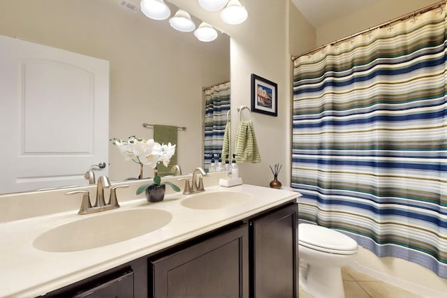 691 Hobie Point Dr, Lewisville, TX 75056 - bathroom with toilet, double vanity, tile patterned floors, and shower / bath combo