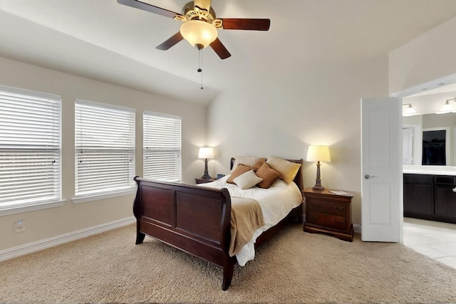 691 Hobie Point Dr, Lewisville, TX 75056 - bedroom with light colored carpet, lofted ceiling, baseboards, ceiling fan, and ensuite bathroom
