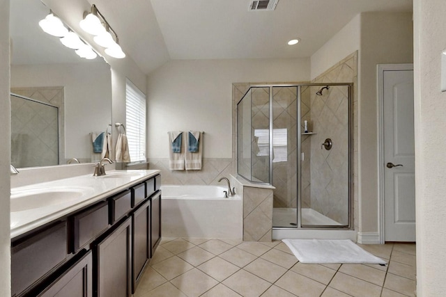 691 Hobie Point Dr, Lewisville, TX 75056 - full bathroom featuring tile patterned floors, a bath, a shower stall, double vanity, and lofted ceiling