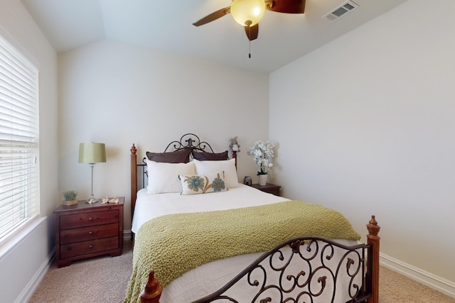 691 Hobie Point Dr, Lewisville, TX 75056 - bedroom featuring light carpet, multiple windows, baseboards, ceiling fan, and vaulted ceiling