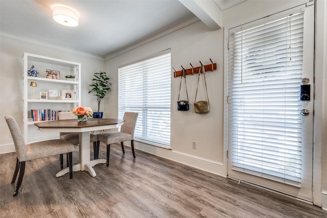 5927 E University Blvd Unit 217, Dallas, TX 75206 - dining space featuring ornamental molding, wood finished floors, and baseboards