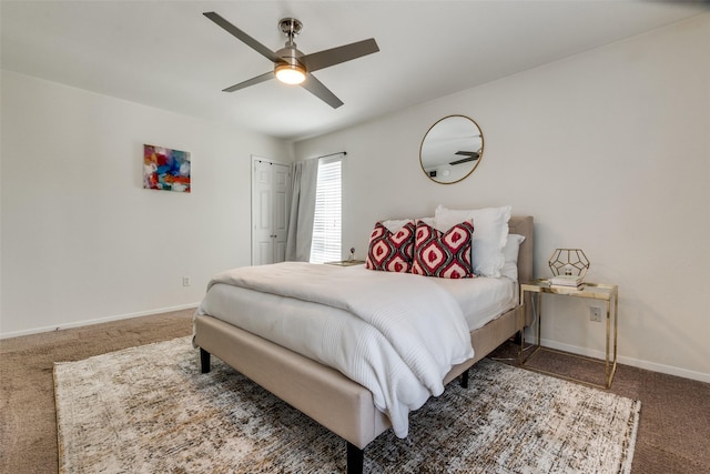 5927 E University Blvd Unit 217, Dallas, TX 75206 - bedroom featuring carpet floors, baseboards, and ceiling fan