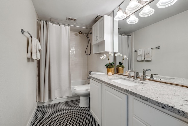 5927 E University Blvd Unit 217, Dallas, TX 75206 - full bath with vanity, toilet, shower / bath combo, and tile patterned floors