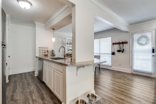 5927 E University Blvd Unit 217, Dallas, TX 75206 - kitchen with a sink, crown molding, dark wood-type flooring, light stone countertops, and dishwasher