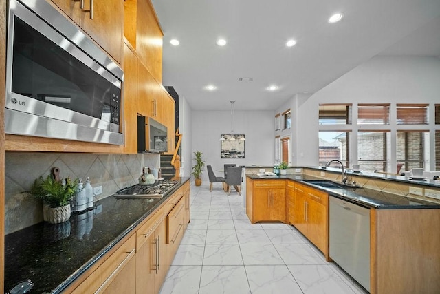 2425 Sir Lovel Ln, Lewisville, TX 75056 - kitchen featuring stainless steel appliances, a sink, light marble finish floors, dark stone countertops, and recessed lighting