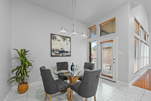 2425 Sir Lovel Ln, Lewisville, TX 75056 - dining area with light marble finish flooring and baseboards
